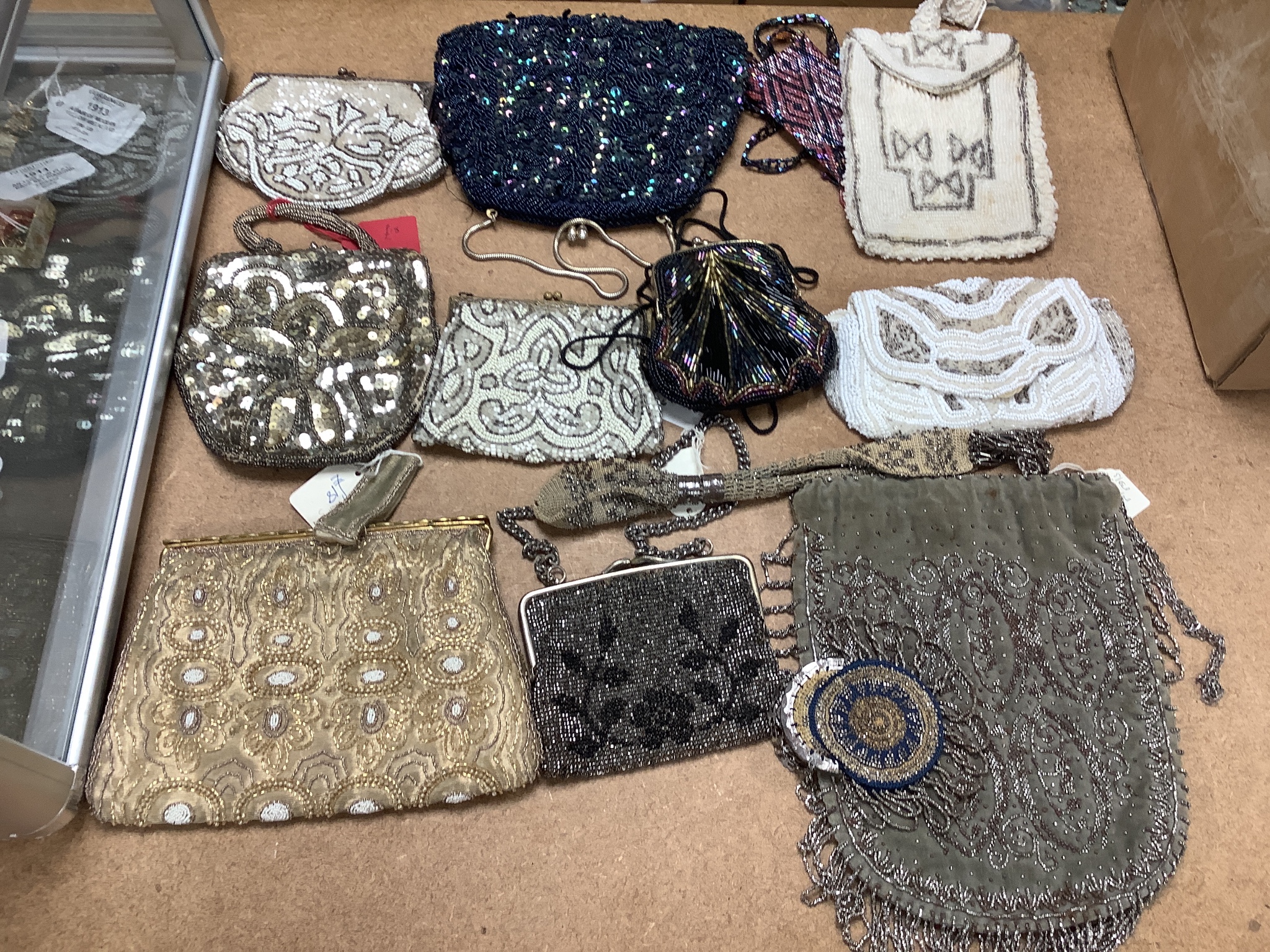 A collection of approximately fifty Victorian and later beadwork, white metal and fabric purses etc.